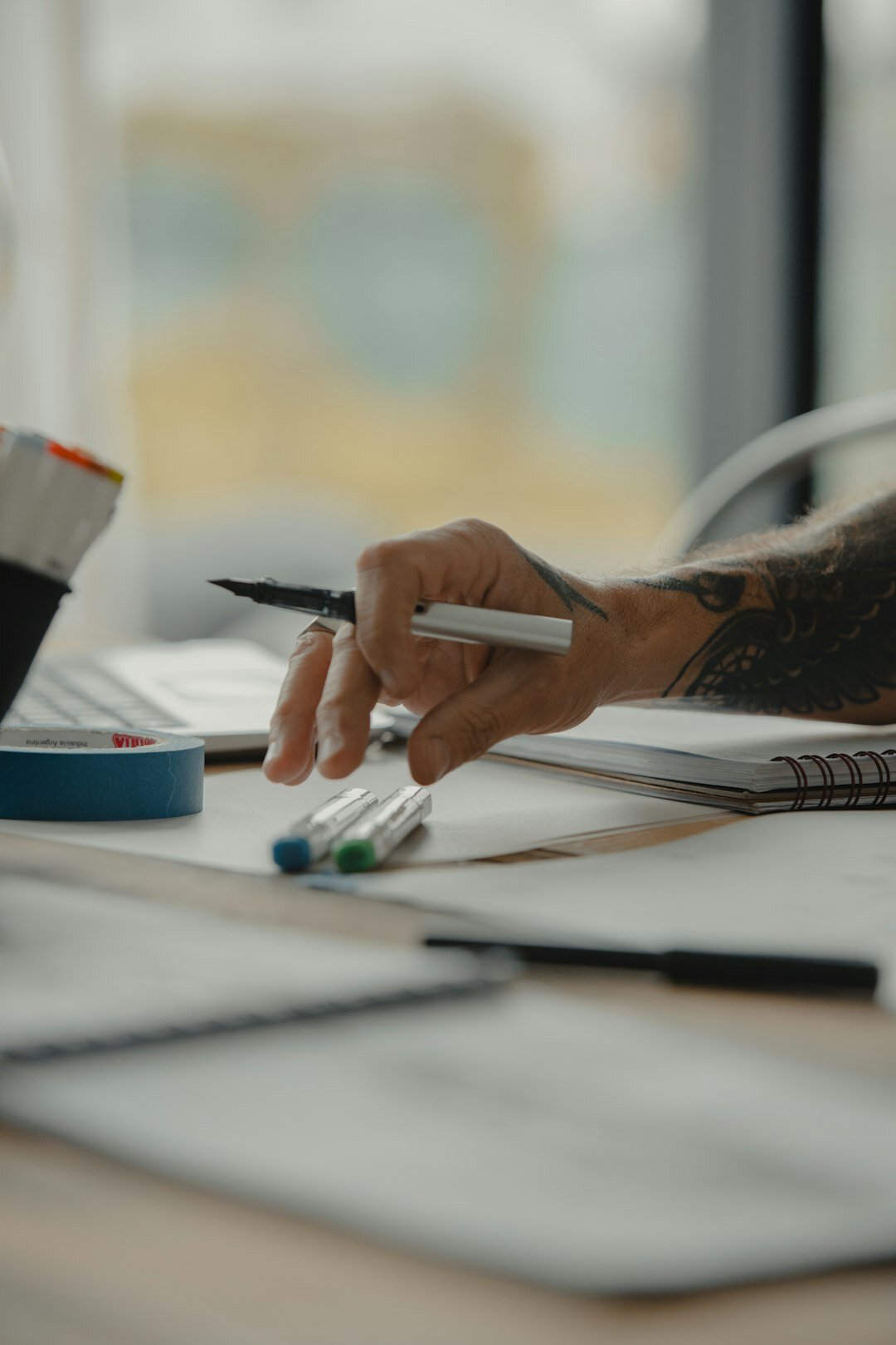 person reviewing documents at desk